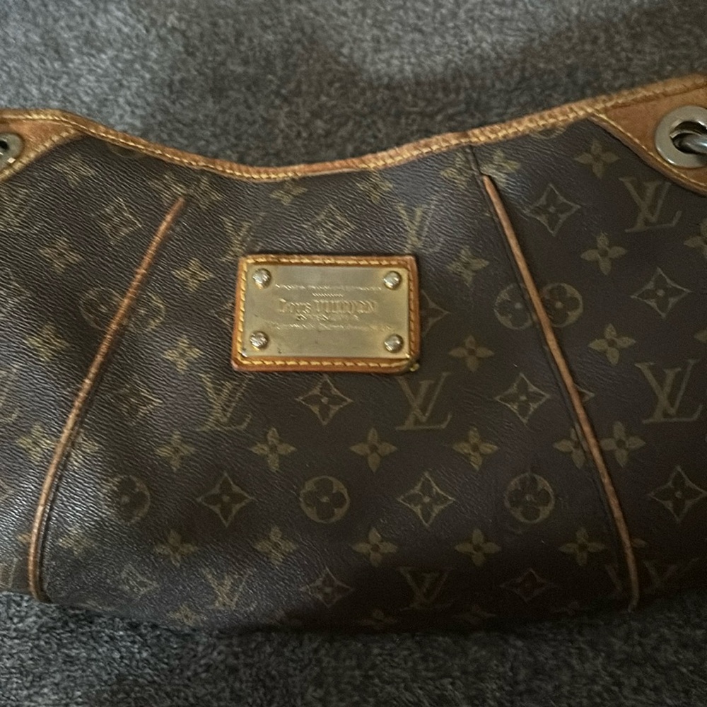 Authentic Louis Vuitton ladies bag in good condition, and recently cleaned.